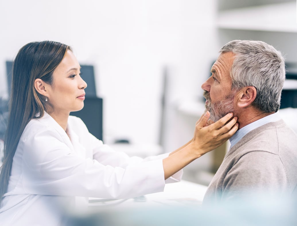 female doctor examining male patient