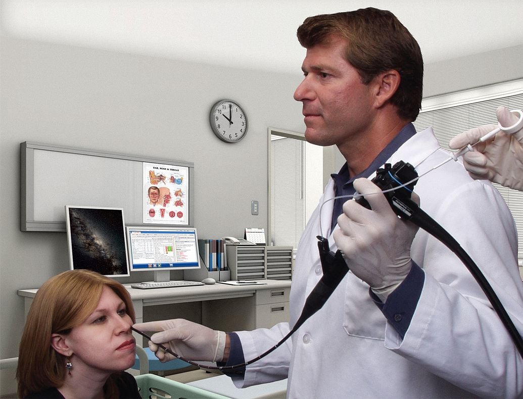 Woman Getting procedure done by male doctor